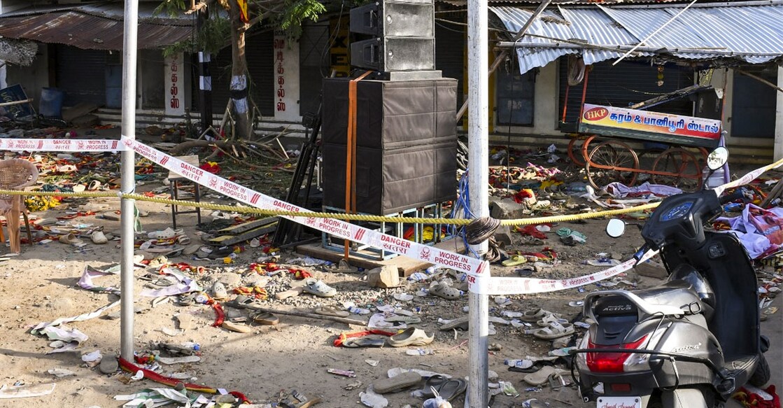 Footwear and other belongings of people who attended the rally of actor and TVK chief Vijay lie on a road in the aftermath of a stampede. Photo: PTI