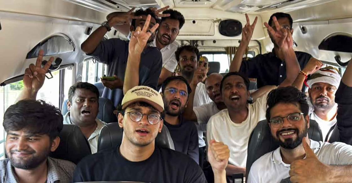 Cockroach Janta Party (CJP) chief spokesperson Saurav Das, national spokesperson Ashutosh Ranka, and other supporters inside a police bus after being detained for entering Jantar Mantar despite heavy barricading and a strong security presence, in New Delhi. Photo: PTI