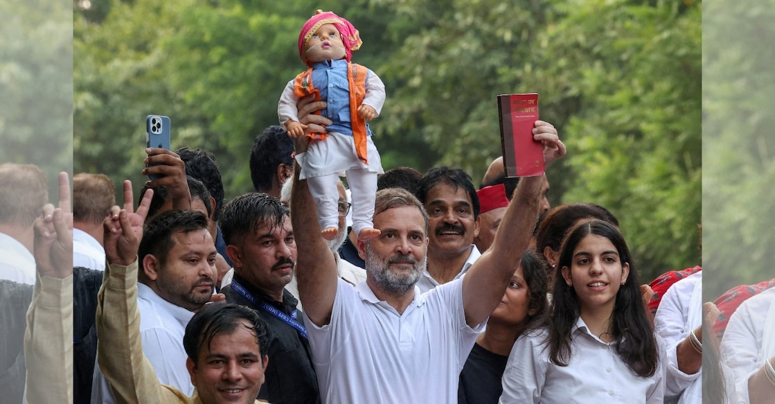 Congress leader and Leader of the Opposition Rahul Gandhi holds a doll depicting Indian Prime Minister Narendra Modi as opposition parties march to the Supreme Court. Photo: Reuters