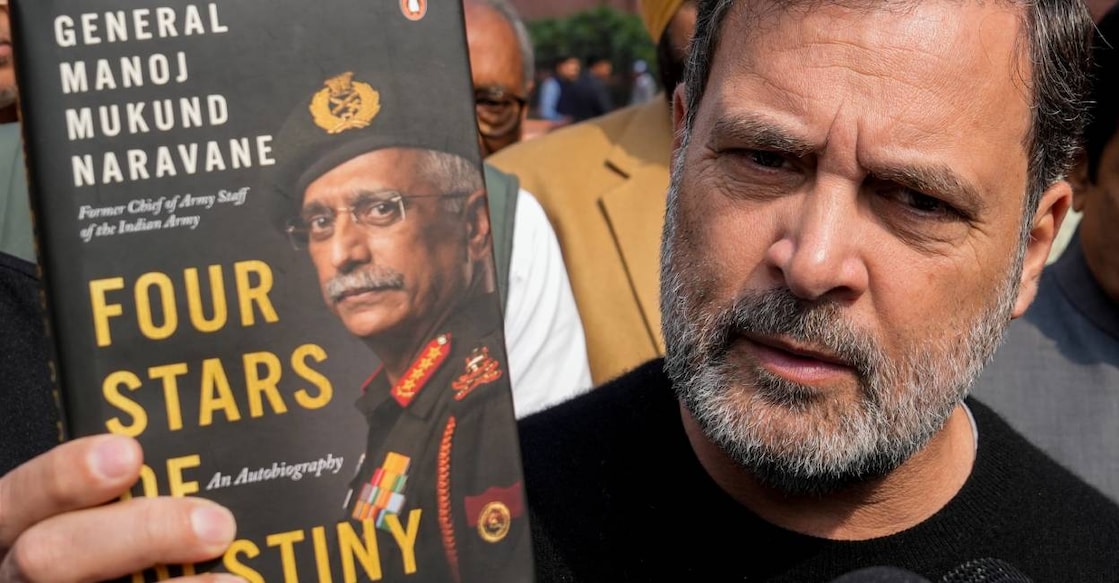 Leader of Opposition in the Lok Sabha Rahul Gandhi shows a copy of the unpublished "memoir" of former Army chief M M Naravane during the Budget Session of Parliament, in New Delh. Photo: PTI