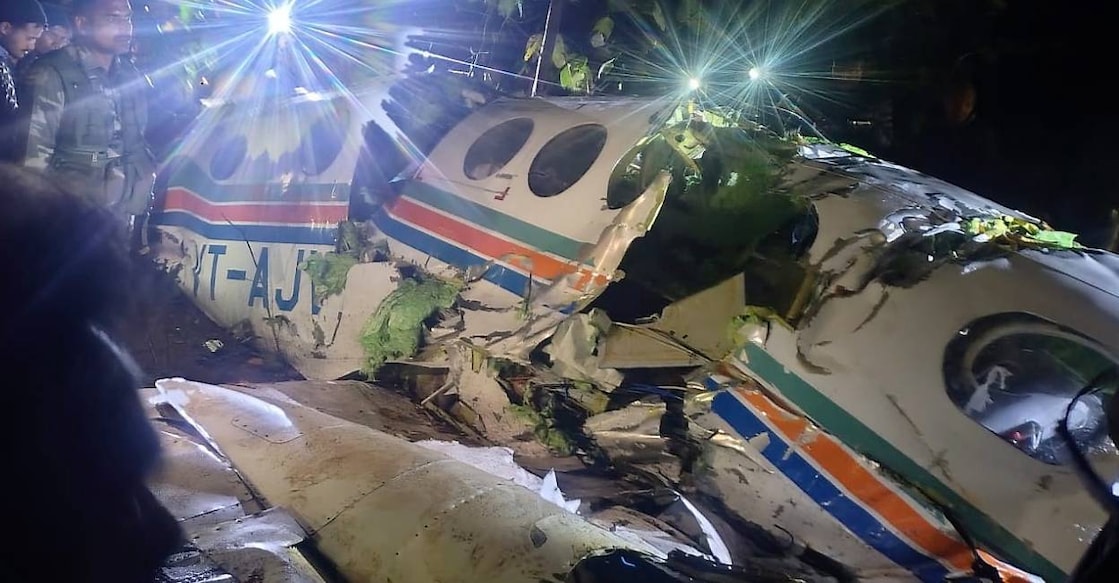 People gather near wreckage of an Redbird Airways Pvt Ltd Beechcraft C90 aircraft VT-AJV operating medical evacuation (Air Ambulance) flight in Chatra district, Jharkhand. Photo: PTI