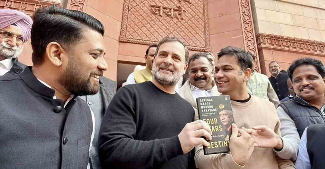 Leader of Opposition in the Lok Sabha Rahul Gandhi shows a copy of the unpublished 'memoir' of former Army chief M M Naravane during the Budget Session of Parliament, in New Delhi. Photo: X/AICC
