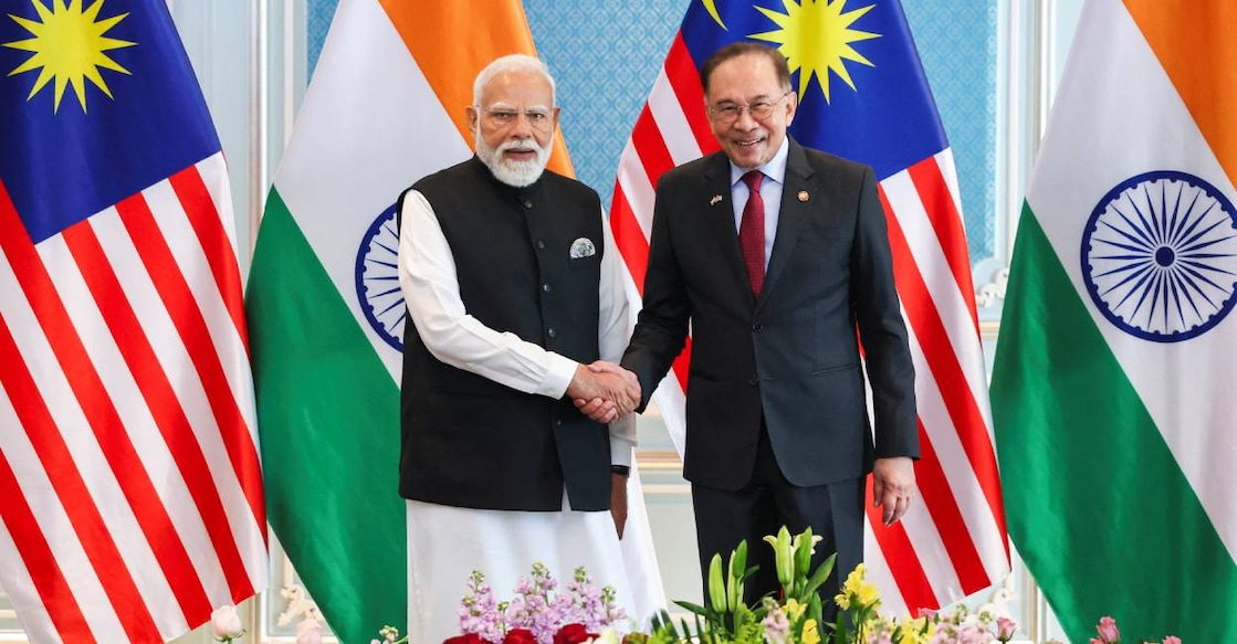 Malaysia's Prime Minister Anwar Ibrahim shakes hands with India's Prime Minister Narendra Modi in Putrajaya on February 8. Photo: AFP