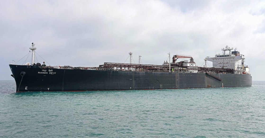 In this image posted on March 17, 2026, crew members and others aboard the Indian-flagged LPG carrier Nanda Devi, carrying 46,500 MT LPG for ship-to-ship transfer, arrives at Vadinar, Gujarat. Photo: @Deendayal_Port/X via PTI Photo