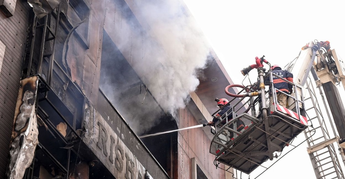 Rescue operations underway after a fire broke out in a residential building near Palam Metro station, in New Delhi. Photo: PTI