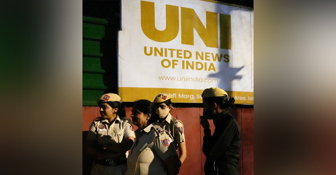 Police personnel outside the United News of India's (UNI) office after it was sealed. Photo: PTI