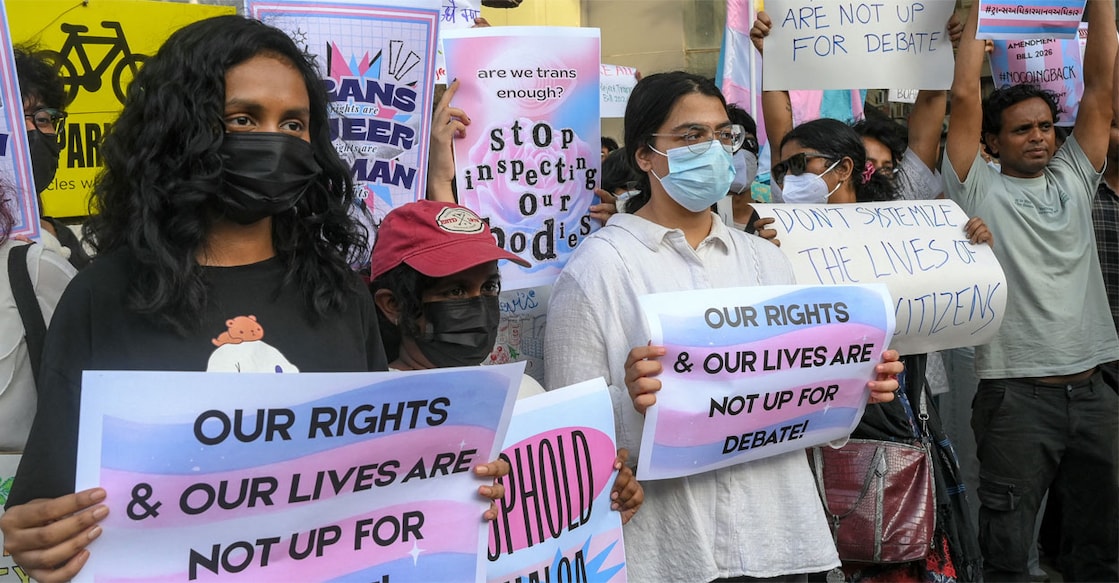 Activists and members of the LGBTQ community hold placards during a protest against the proposed Transgender Persons (Protection of Rights) Amendment Bill in Ahmedabad on March 22, 2026. Photo: Shammi Mehra/AFP