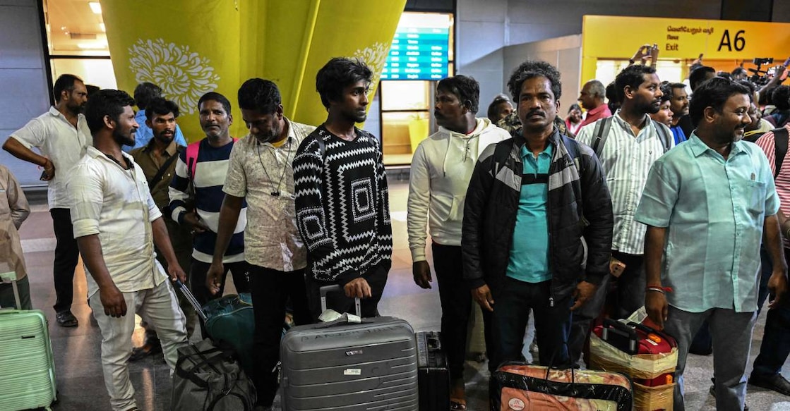 Indian fishermen, who were stranded in Iran, wait for transportation after arriving at the airport in Chennai on April 4, 2026 following their evacuation from Iran. Photo: AFP