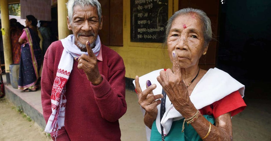 Elderly people show their ink-marked fingers after casting votes during the Assam Assembly elections, at a polling station, in Guwahati, Thursday, April 9, 2026. Photo: PTI