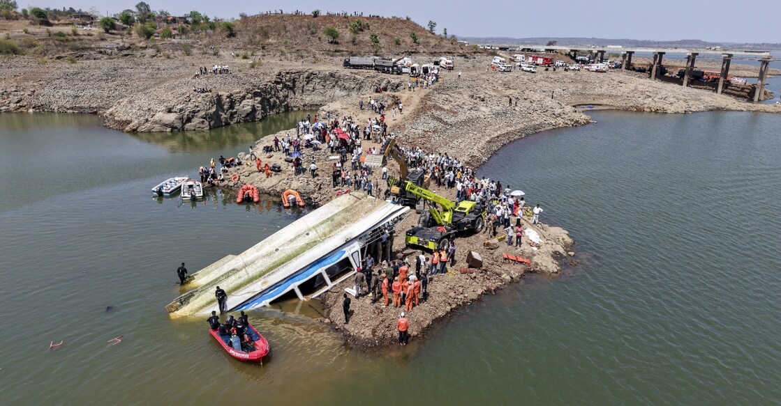 NDRF and other rescue personnel conduct an operation to recover the cruise boat, carrying 29 passengers and two crew members, that overturned in Bargi Dam due to a sudden storm, in Jabalpur district, Madhya Pradesh, on Friday. Photo: PTI. 