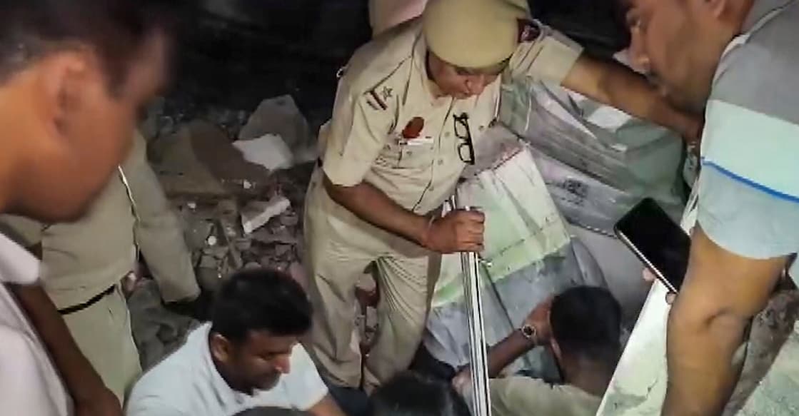 Debris of a five-storey building after its collapse, near Saket Metro station area, in New Delhi. Photo: PTI. 