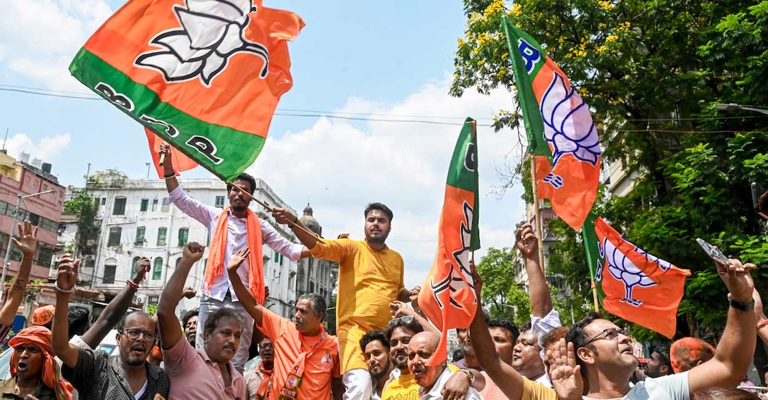 BJP workers celebrate at the state party headquarters as trends show the party leading in the West Bengal Assembly elections, in Kolkata, Monday, May 4, 2026. Photo: PTI 