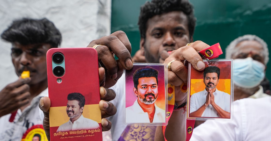 Supporters hold portraits of Tamilaga Vettri Kazhagam (TVK) chief Vijay during vote tabulation on the day of Assembly election results, in Chennai, Monday, May 4, 2026. Photo: PTI