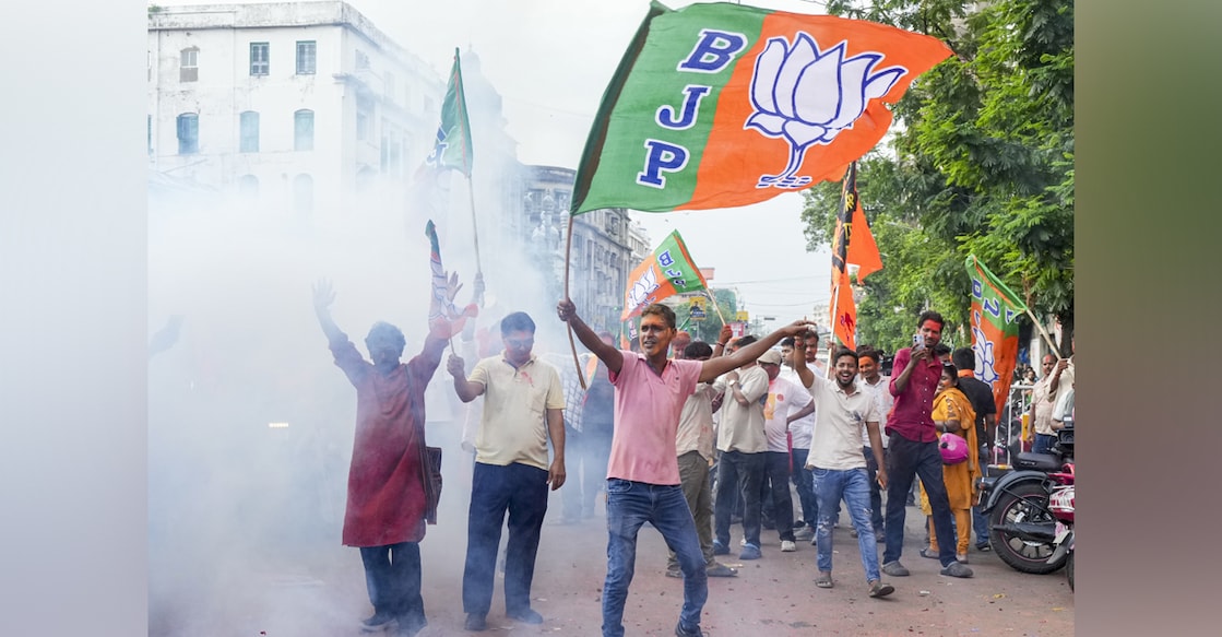 BJP supporters light firecrackers during election victory celebrations in West Bengal. Photo: PTI