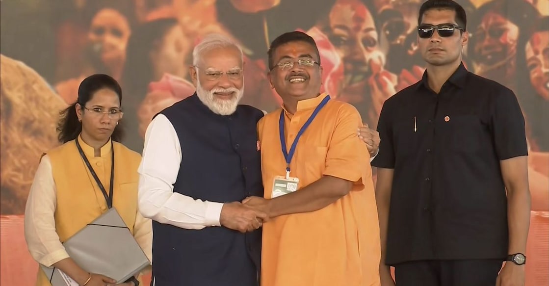 Prime Minister Narendra Modi greets newly-elected Chief Minister of West Bengal Suvendu Adhikari after the oath-taking ceremony, at Brigade Parade Ground in Kolkata, West Bengal. Photo: PTI