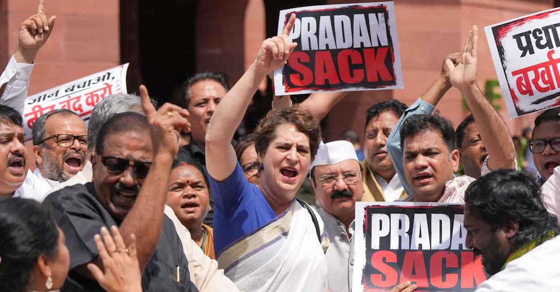 Congress MPs Priyanka Gandhi Vadra, Kishori Lal Sharma and Hibi Eden and others raise slogans during a protest by opposition leaders demanding resignation of Union Education Minister Dharmendra Paradhan. Photo: PTI