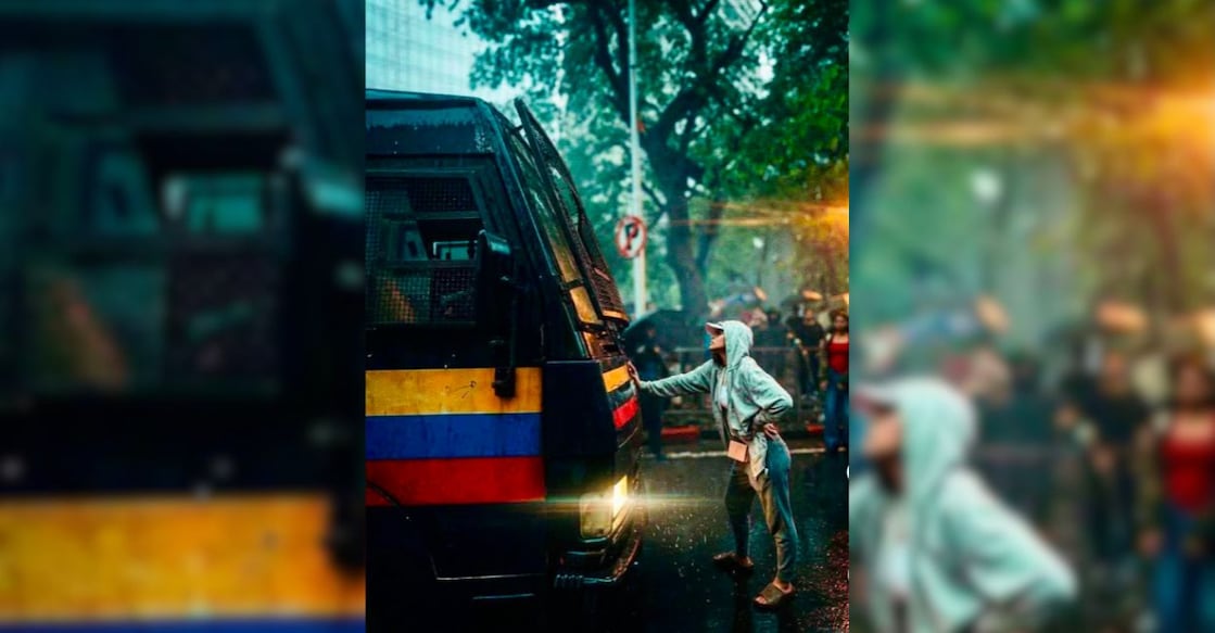 Actress Rhiya Ahir stands in front of a Mumbai Police van during the CJP protests near Shivaji Park, Dadar. Photo: Instagram/@indrajoshi