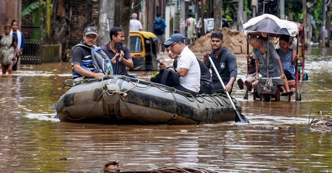 SDRF personnel rescue people from a waterlogged area following rainfall, at Anil Nagar, in Guwahati of Assam on Aug. 9, 2026. Photo: PTI