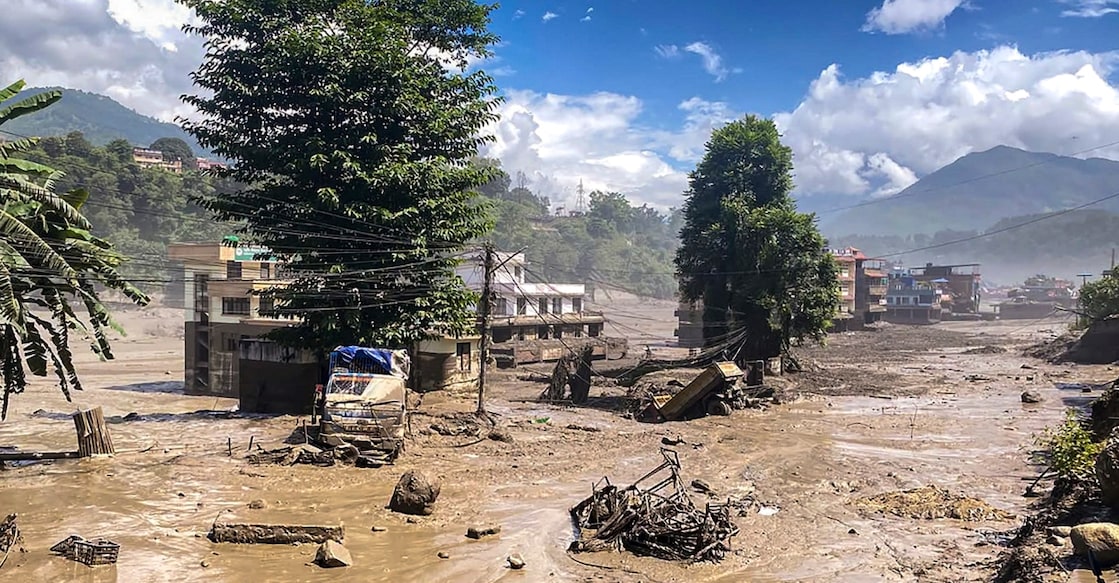 Debris lies scattered after a sudden and massive flood surged through the Bhote Koshi River, killing four people, in Rasuwa, Nepal. Photo: PTI Photo