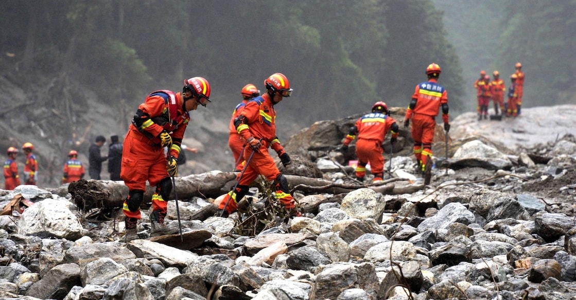 Firefighters conduct search and rescue operations along a river, after a mudslide in Gyirong county, Shigatse, Tibet Autonomous Region, China. Photo: Reuters