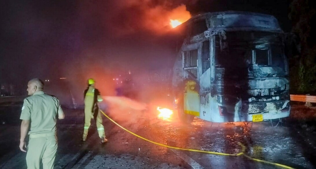 Firefighters at the site after a sleeper bus caught fire on the Yamuna Expressway in the Greater Noida area. Photo: PTI