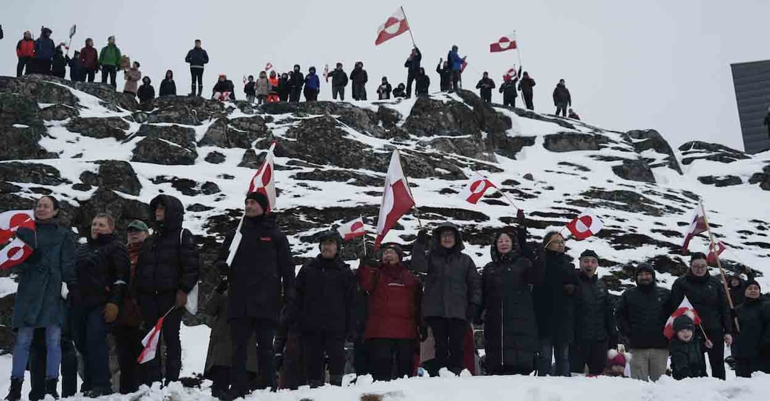 People wave Greenlandic flags as they take part in a demonstration to protest against the US President's plans to take Greenland in January in Nuuk. File photo: AFP/Alessandro Rampazzo