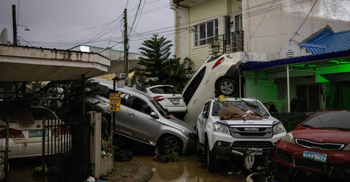 Damaged cars are toppled in a subdivision after heavy flooding brought by Typhoon Kalmaegi. Photo: REUTERS/Eloisa Lopez