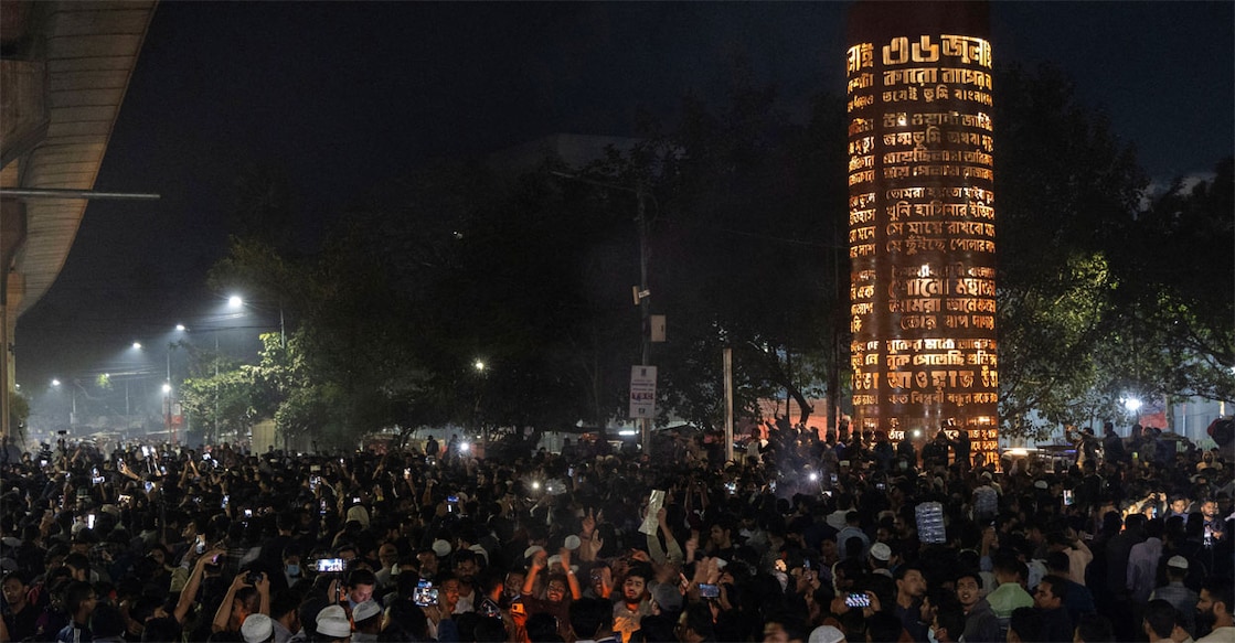 People gather following the death of Sharif Osman Hadi, a student leader who had been receiving treatment in Singapore after being shot in the head, in Dhaka. Photo: REUTERS/Abdul Goni