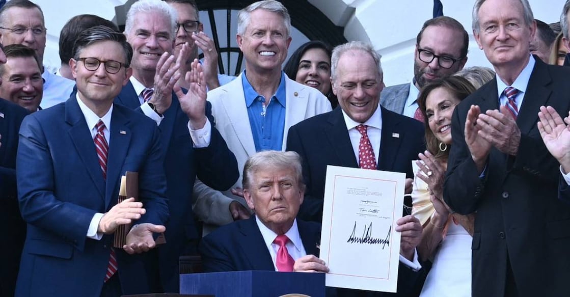 trump-bill-c US President Donald Trump (C) shows his signature on the "Big Beautiful Bill Act" at the White House in Washington. Photo: AFP