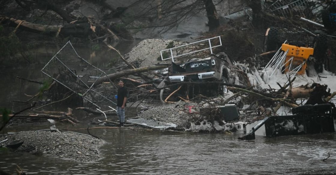 texas-flood-us A member of the public stands next to overturned vehicles and broken trees after flooding caused by a flash flood at the Guadalupe River in Kerrville, Texas, on July 5, 2025. Photo: AFP