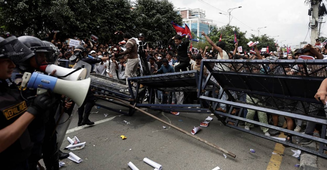 Demonstrators try to break through police barricades during a protest against corruption and the government's decision to block several social media platforms, in Kathmandu, Nepal, September 8, 2025. Photo: Reuters