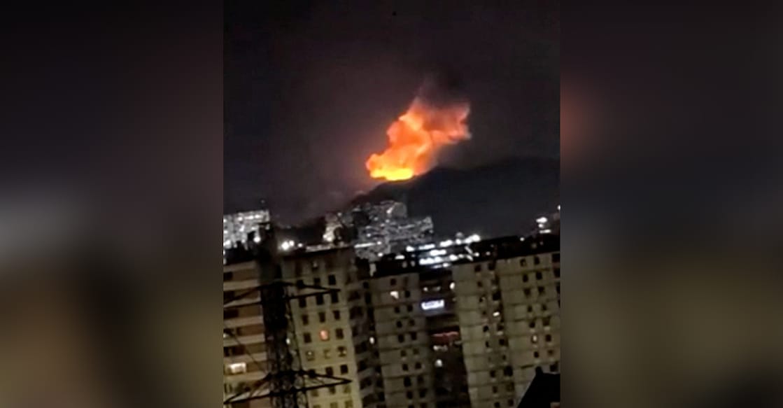 A column of smoke rises during multiple explosions in the early hours of the morning, in Caracas, Venezuela, January 3, 2026 in this screen grab obtained from video obtained by Reuters. Video Obtained by Reuters/via REUTERS