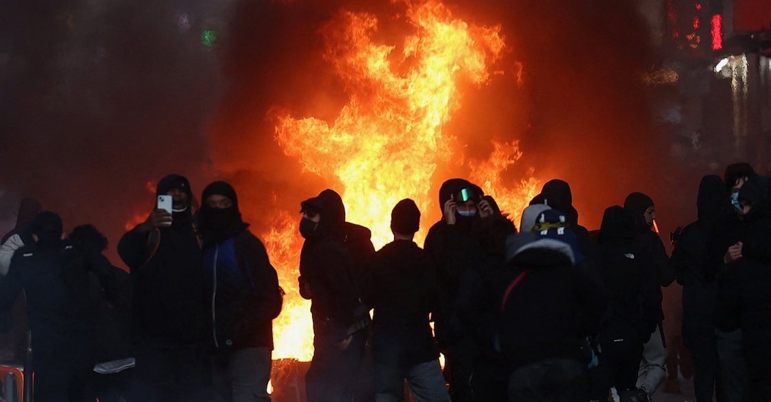 Flames and smoke rise during civil unrest, the day after a national day of demonstrations against the cost of living and rising fuel prices, in Paris, France, October 18, 2026. Photo: Reuters