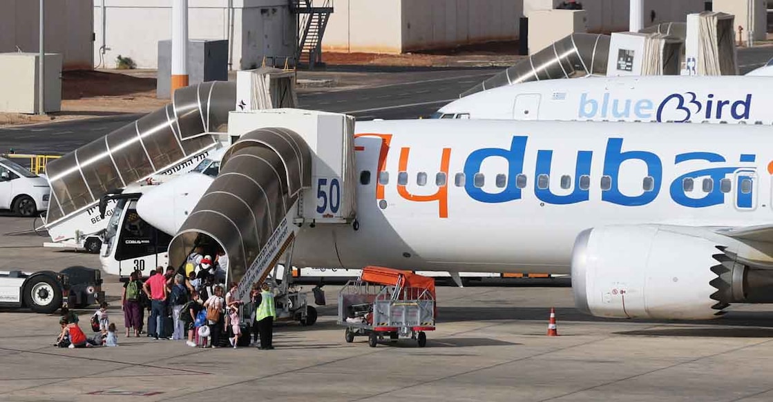 Travellers board a FlyDubai aircraft at Ben Gurion International Airport after a separate FlyDubai flight from the United Arab Emirates to Israel was diverted to Saudi Arabia following an emergency signal, in Lod, near Tel Aviv, Israel, September 30, 2026. Photo: REUTERS/Ammar Awad