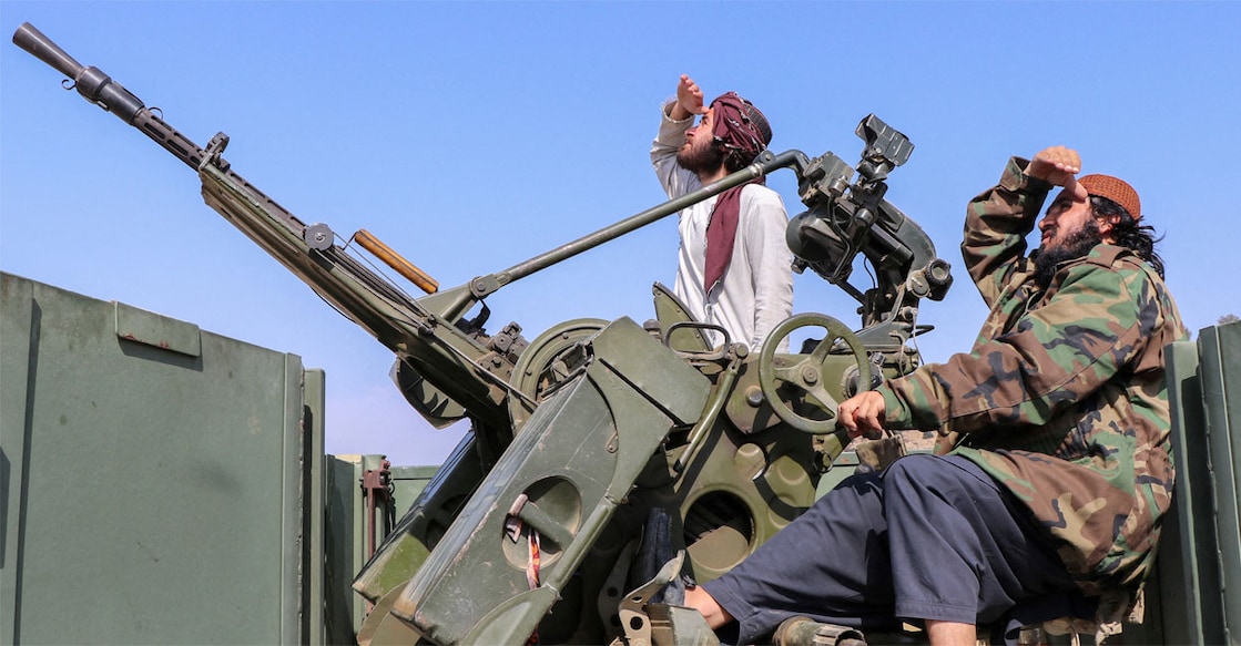 Taliban soldiers sit next to an anti-aircraft gun while on lookout for Pakistan's fighter jets, in Khost province, Afghanistan, February 27, 2026. Photo: REUTERS/Stringer