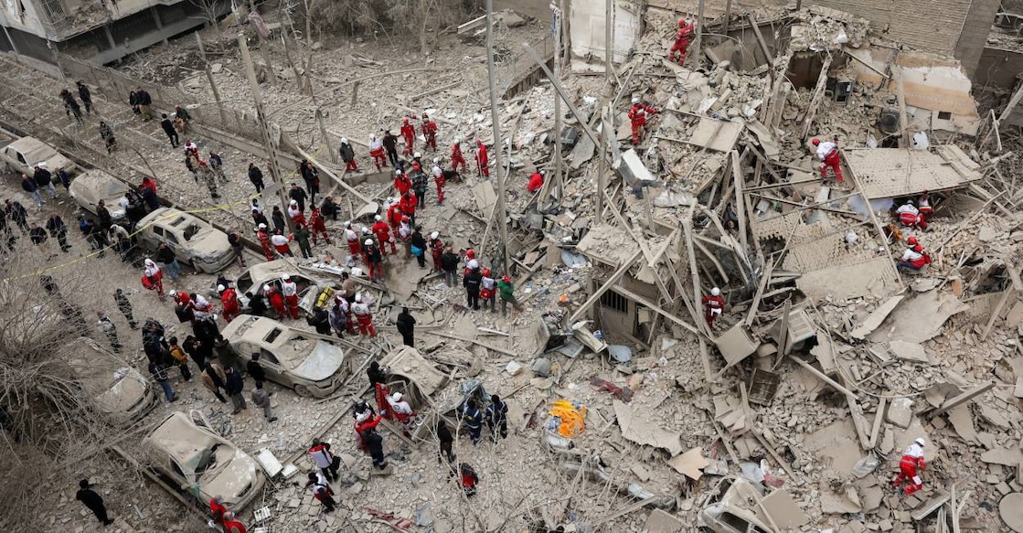 Emergency personnel work at the site of a strike on a residential building, amid the US-Israeli conflict with Iran, in Tehran, Iran. Photo: Reuters