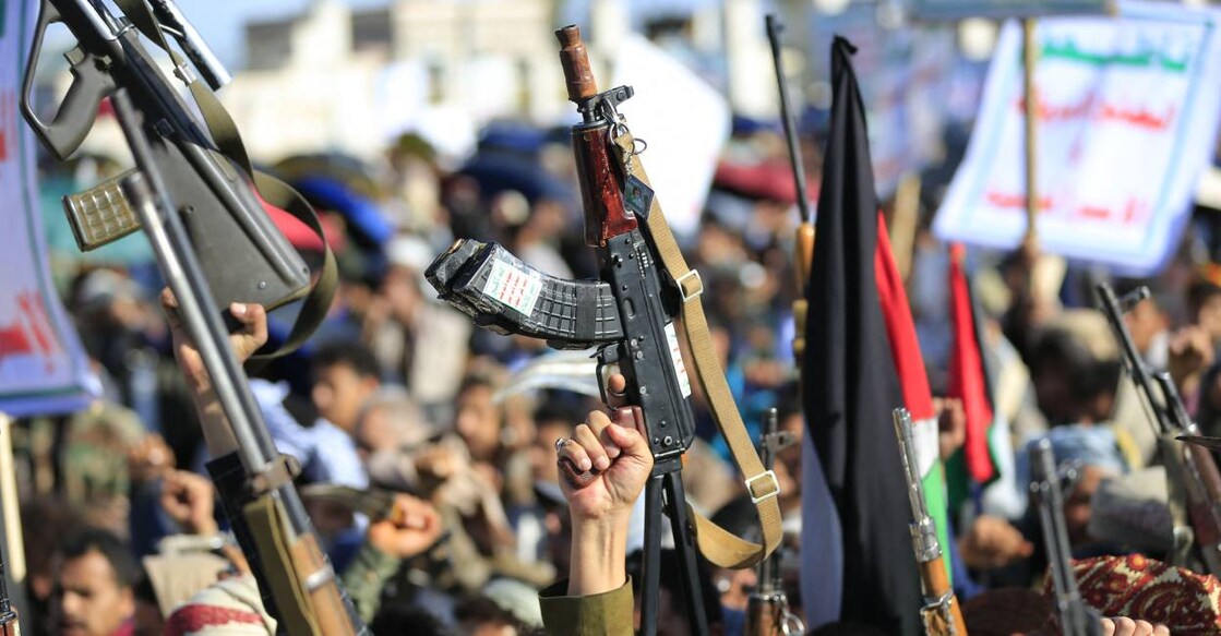 Houthis brandish their weapons as they rally in solidarity with Iran and Lebanon. Photo: AFP