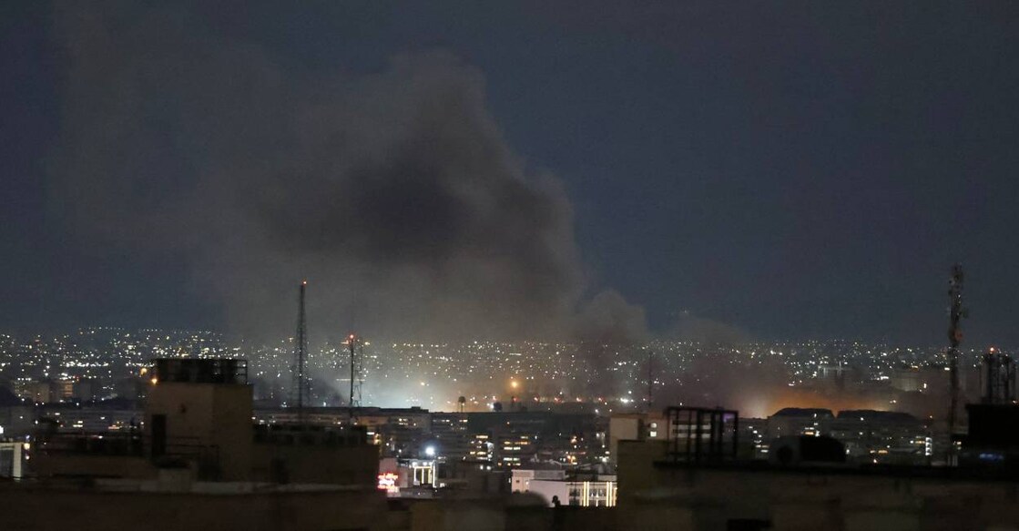 A plume of smoke rises from the site of a strike in Tehran early on March 28, 2026. Photo: AFP