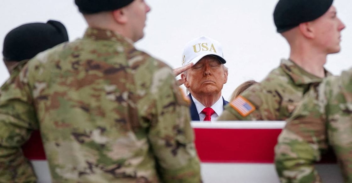 US President Donald Trump pays homage to military personnel killed in Iran strike in Kuwait. Photo: Reuters