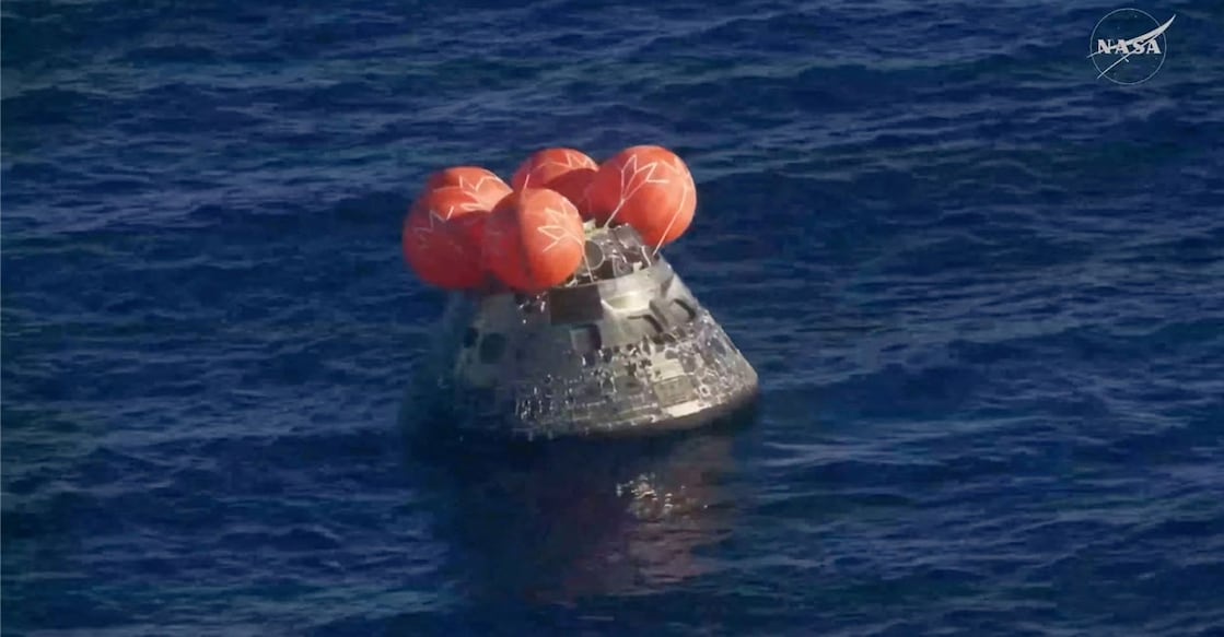 The Artemis II crew capsule floats in the Pacific Ocean following splashdown in this screengrab from a livestream video after the Artemis II crew's flyby of the Moon, April 10, 2026. NASA/Handout via REUTERS