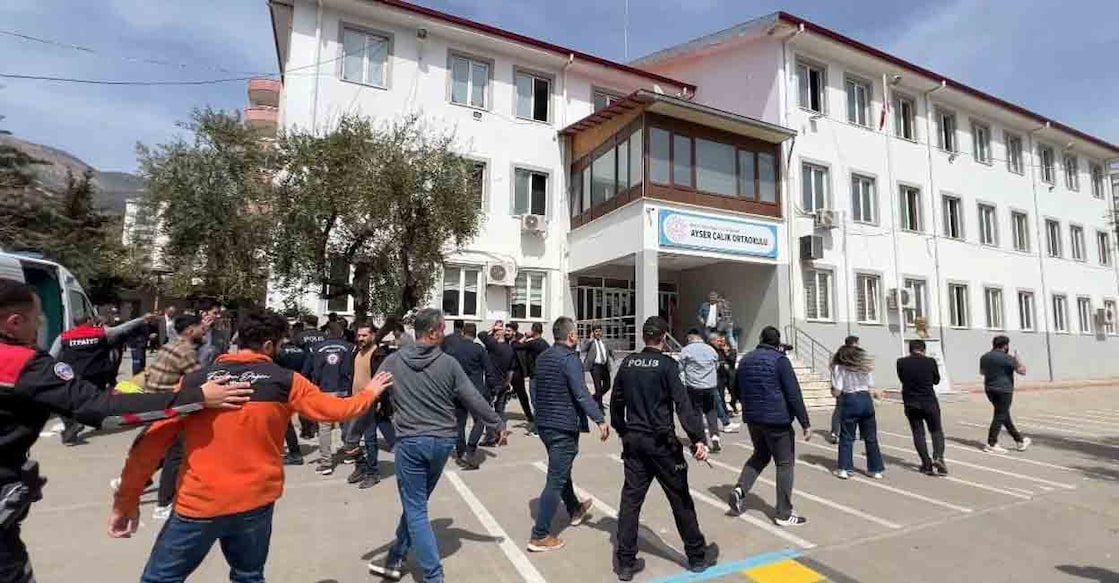 Police officers in uniform and plainclothes police secure the site after a deadly school shooting, in the southeastern province of Kahramanmaras, Turkey, April 15, 2026. Picture taken with a mobile phone. Photo: IHA (Ihlas News Agency) via REUTERS