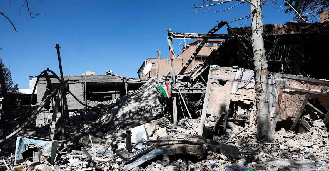 An Iranian flag lies amidst the rubble of a building of the Sharif University of Technology, which was damaged in a strike, amid the U.S.-Israeli conflict with Iran, in Tehran, Iran, April 7, 2026. Majid Asgaripour/WANA (West Asia News Agency) via REUTERS