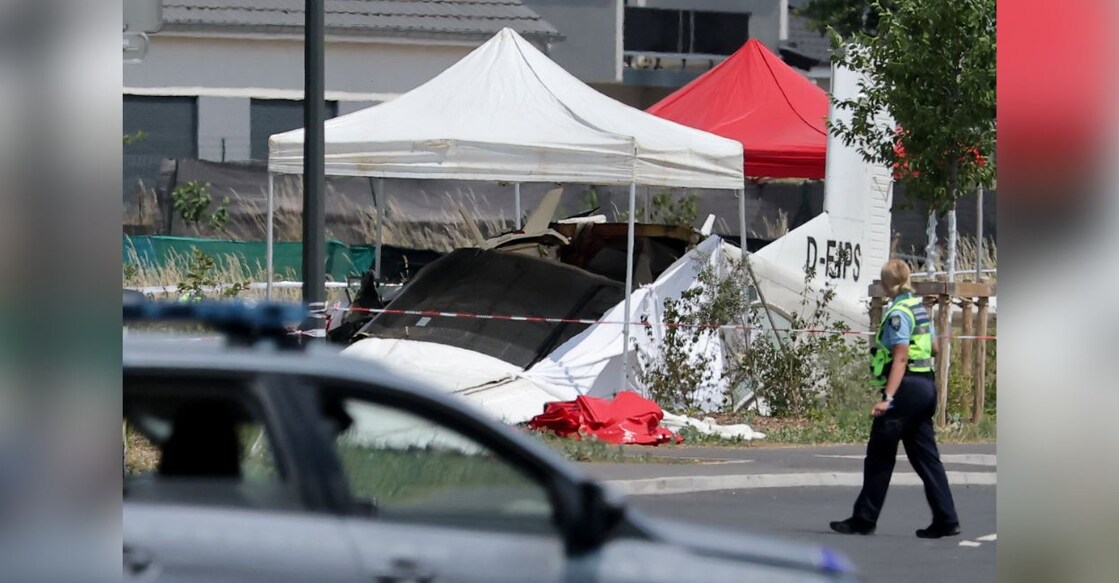 A rescuer works at the site of a plane crash in Tomblaine, France. REUTERS/Christian Hartmann