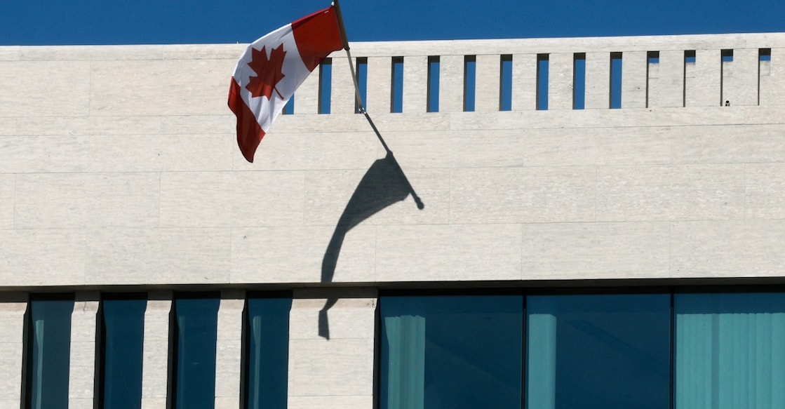 A Canadian flag flies over an office window of the Canadian embassy in Washington. Photo: Reuters