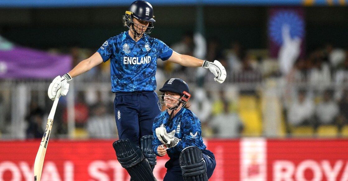 England's Amy Jones (L) and Tammy Beaumont gesture during the ICC Women's Cricket World Cup match against South Africa. Photo: AFP