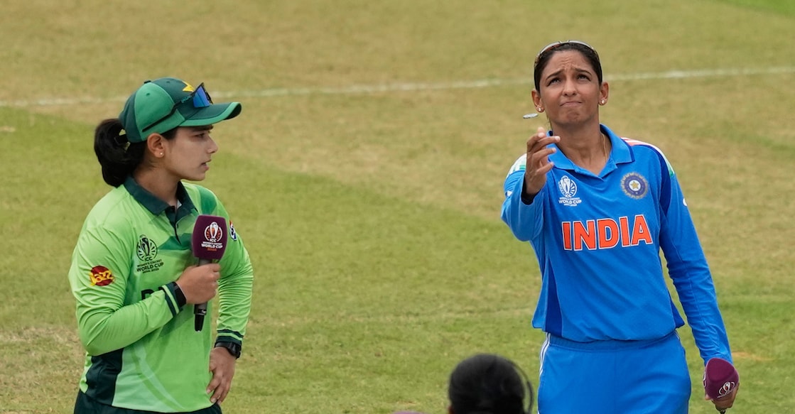 India's captain Harmanpreet Kaur tosses a coin as Pakistan's captain Fatima Sana calls before the ICC Women's Cricket World Cup match at Premadasa Stadium in Colombo, Sri Lanka on October 5, 2025. Photo: PTI