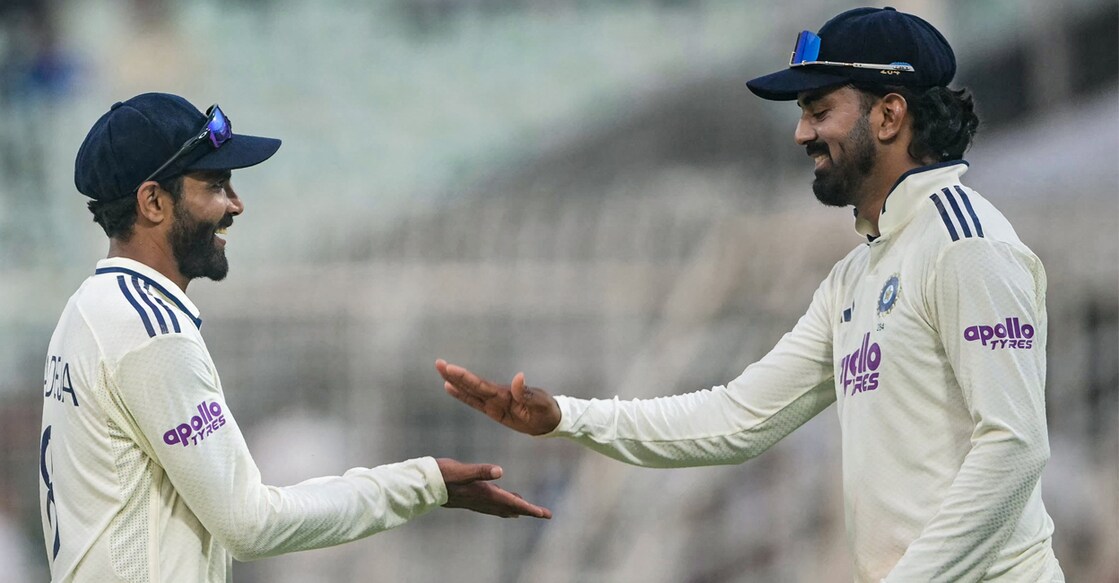 India's Ravindra Jadeja (L) shakes hands with his teammate KL Rahul as they leave the ground at the end of play on the second day. Photo:AFP
