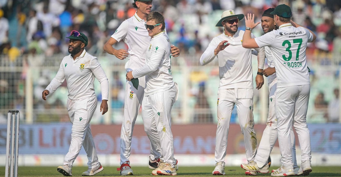 South Africa's captain Temba Bavuma (left), Marco Jansen (centre) and Ryan Rickelton celebrate their team's win at the end of the first Test cricket match between India and South Africa at the Eden Gardens in Kolkata on November 16, 2025. Photo: AFP/ Dibyangshu Sarkar 