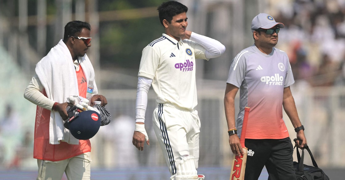 India's captain Shubman Gill walks back to the pavilion after his injury during the second day of the first Test against South Africa at the Eden Gardens in Kolkata on November 15, 2025. Photo: AFP/ Dibyangshu Sarkar 
