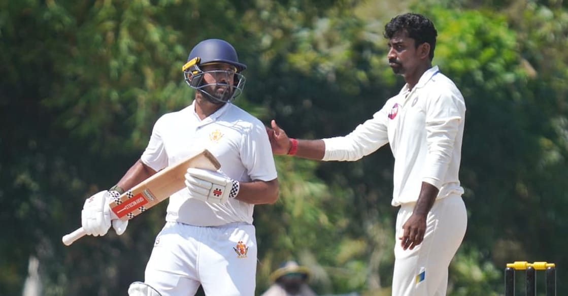 Karnataka's Karun Nair (left) with Kerala's Baba Aparajith on Day 2 of the Ranji Trophy at Mangalapuram in Thiruvananthapuram on November 2, 2025. Photo: KCA